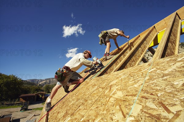 Construction workers working on construction site. USA, Colorado.
Photo : Kelly