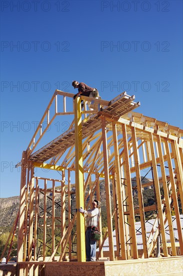 Construction workers working on construction site. USA, Colorado.
Photo : Kelly