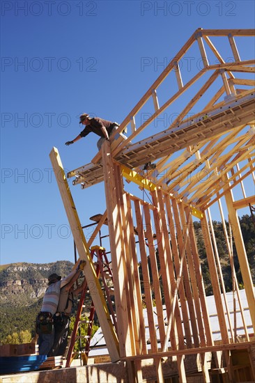 Construction workers working on construction site. USA, Colorado.
Photo : Kelly