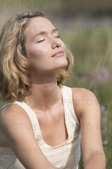 Woman relaxing on meadow.
Photo : Jan Scherders