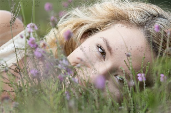 Woman relaxing on meadow.
Photo : Jan Scherders