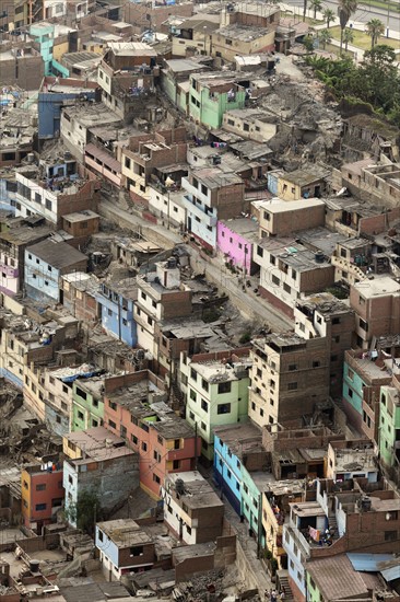 Aerial view to slums district. Lima, Peru.
Photo : Henryk Sadura