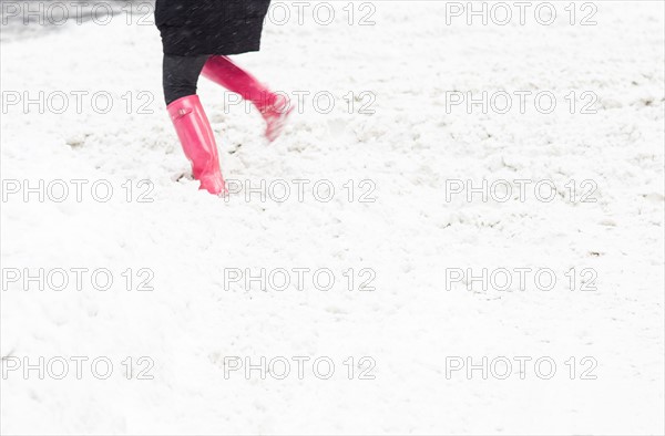 Low section of person dancing in snow. New York City, USA.