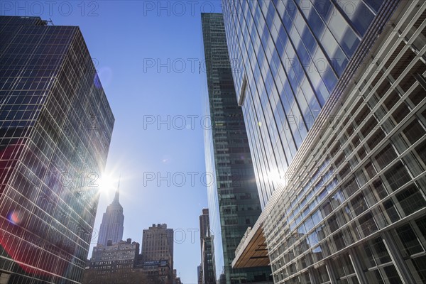 Skyscrapers with solar flare. New York City, USA.