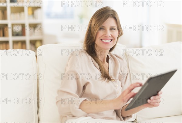 Portrait of woman using tablet pc.