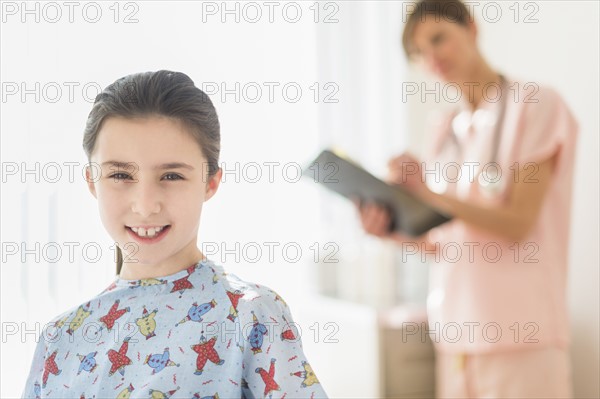 Girl (8-9) in doctor's office.