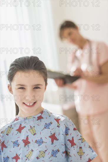 Girl (8-9) in doctor's office.