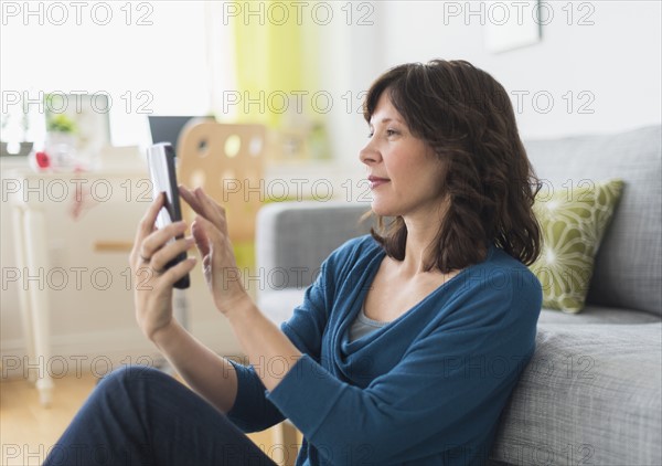 Woman using tablet pc at home.