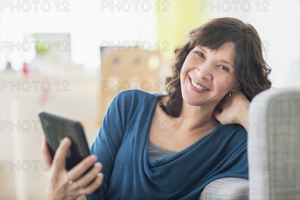 Portrait of woman holding tablet pc.