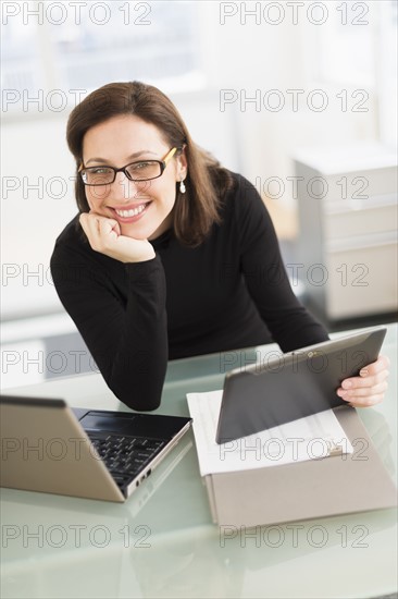 Portrait of businesswoman working in office.