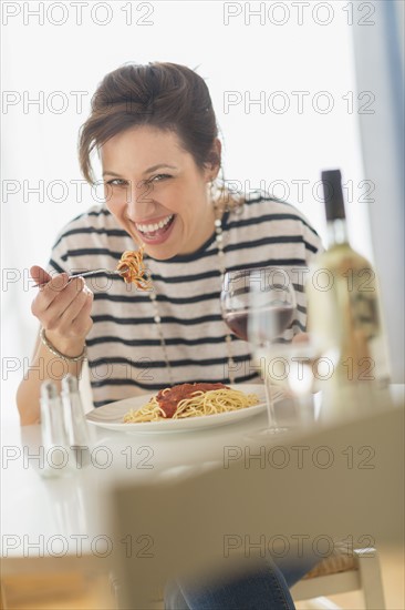 Woman eating spaghetti.