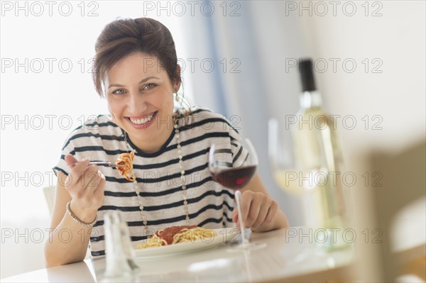 Woman eating spaghetti.