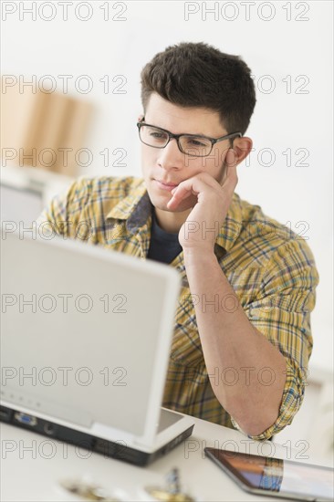 Young man using computer.