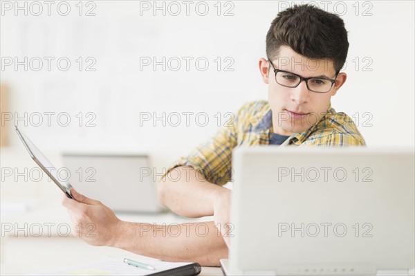 Young man using tablet.