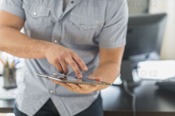 Young man using tablet.