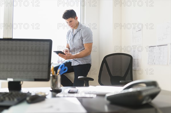 Young man using tablet.