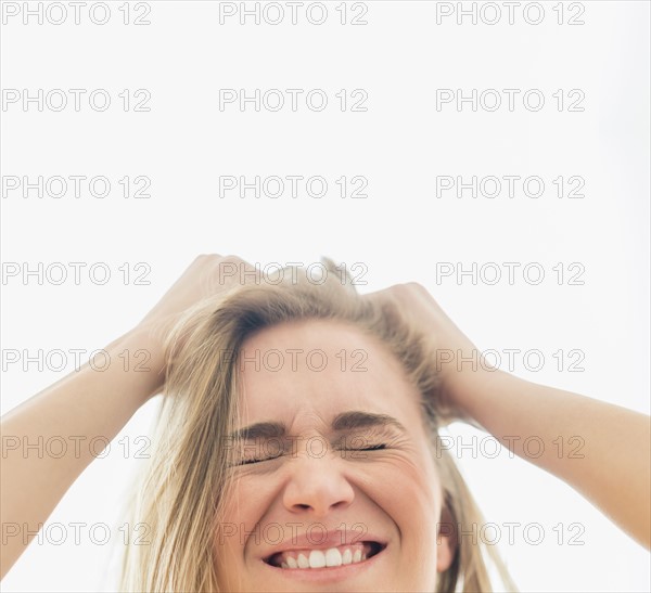 Frustrated woman pulling hair.