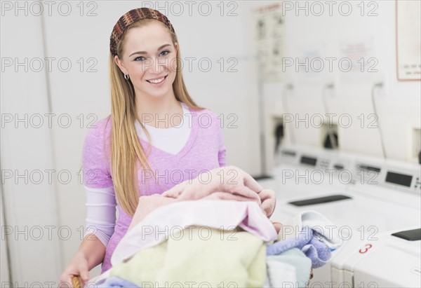 Woman in laundry room.