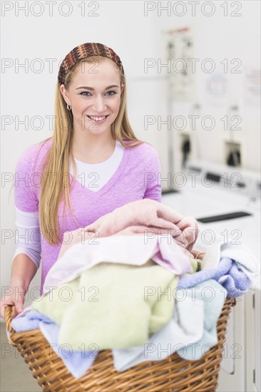 Woman in laundry room.