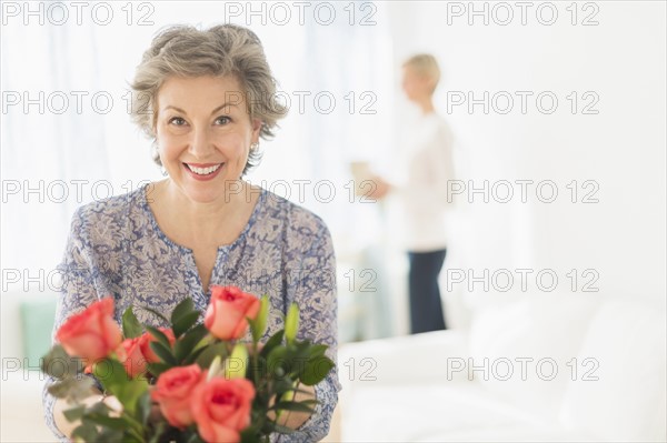 Woman arranging bouquet.