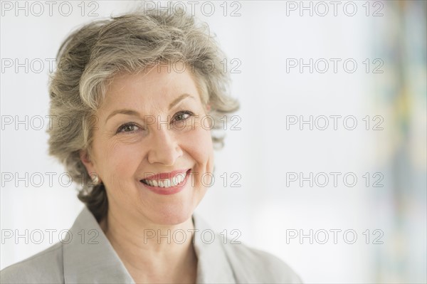 Portrait of smiling woman.