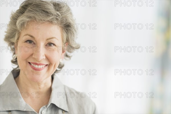 Portrait of smiling woman.