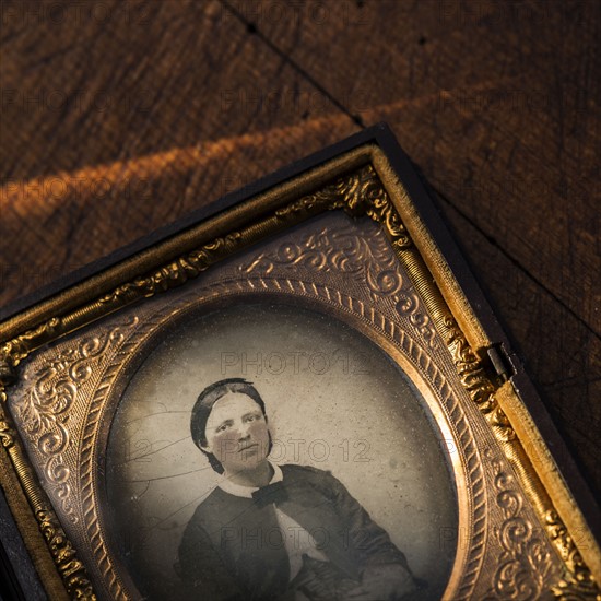 Studio shot of old fashioned photograph in picture frame.