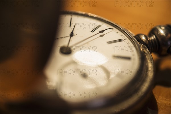 Studio shot of old fashioned pocket watch.