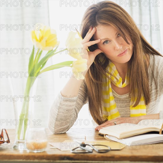 Portrait of woman at desk.