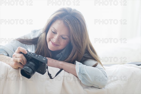 Portrait of woman photographing.