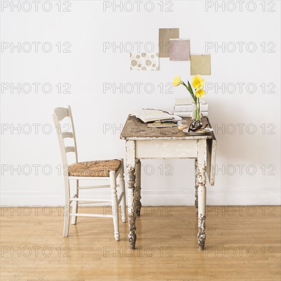 Old desk and chair in room.