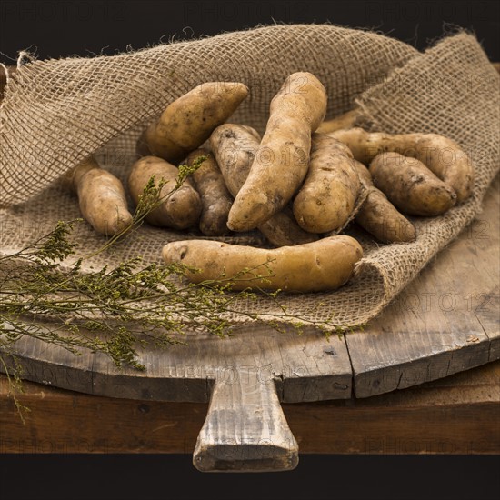 Studio shot fingerling potatoes on cutting board.