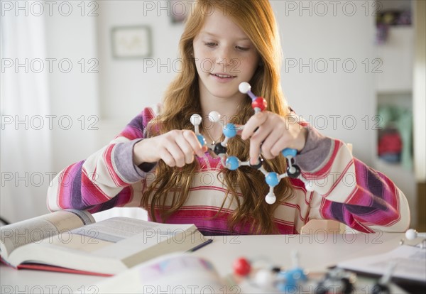 Girl (12-13) doing homework.
Photo : Jamie Grill