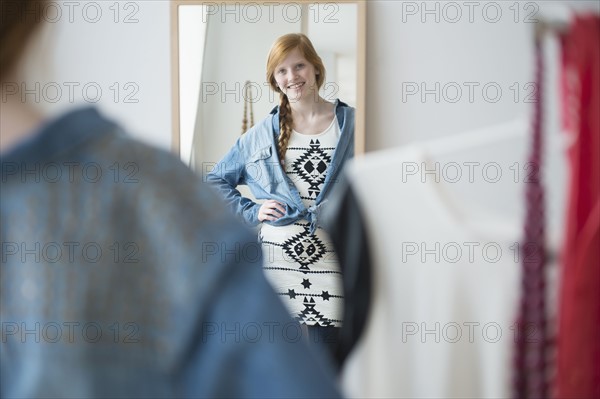 Girl (12-13) getting dress.
Photo : Jamie Grill