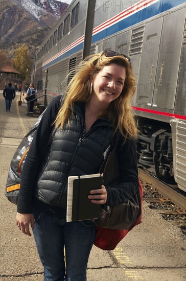 Woman smiling at train station. Glenwood Springs, Colorado, USA.
Photo : Kelly