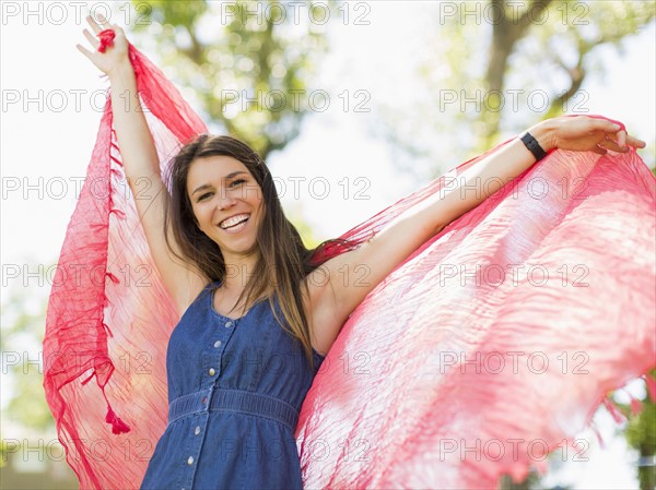 Young woman playing with scarf in park. Salt Lake City, Utah, USA.
Photo : Jessica Peterson