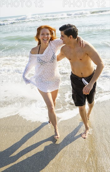 Portrait of couple on beach.