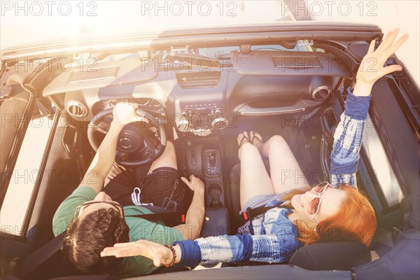 Elevated view of couple in car.