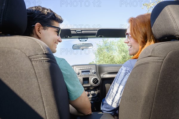 Couple sitting in car.