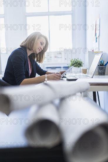 Side view of business woman in office.