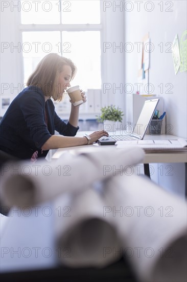 Side view of business woman in office.