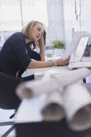 Side view of business woman in office.