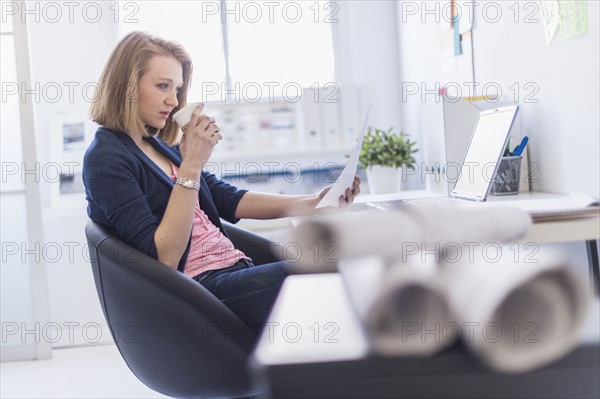 Side view of business woman in office.