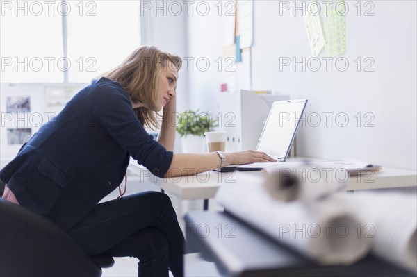 Side view of business woman in office.