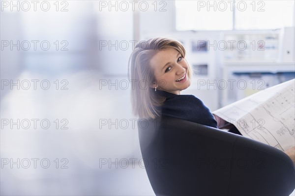 Portrait of smiling business woman in office.