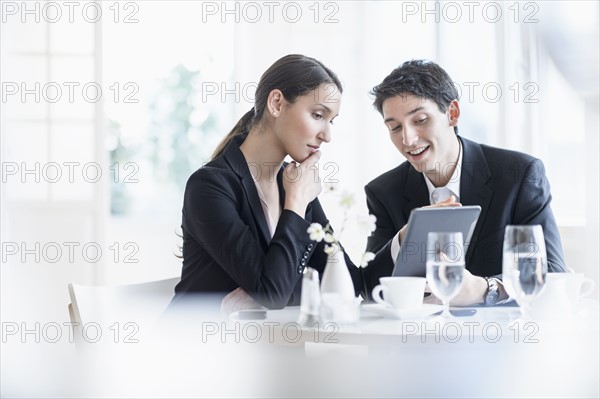 Woman and man at business lunch.