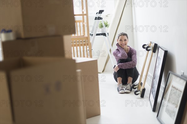 Portrait of young woman in new home.