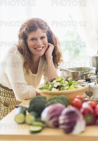 Woman cooking in kitchen.