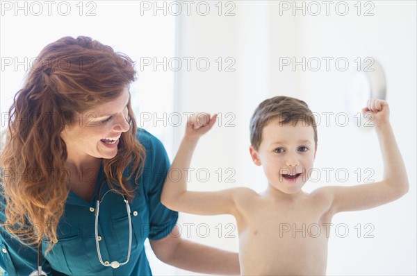 boy (6-7) undergoing medical exam.