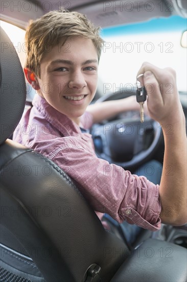 Teenage boy (16-17) driving his first car.